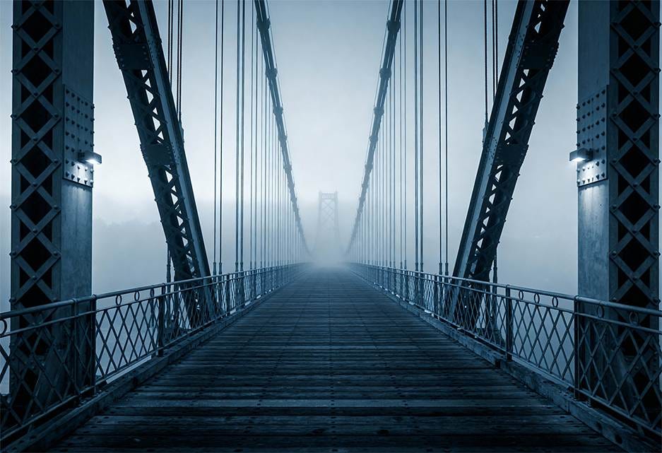 A bridge with a foggy sky

AI-generated content may be incorrect.