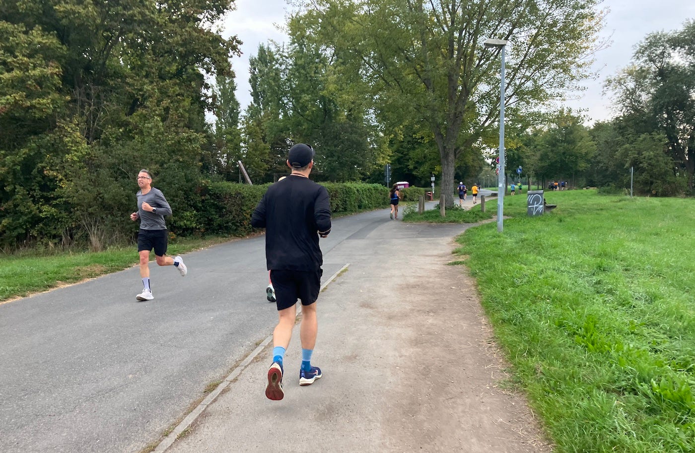 Runners on both sides of the path