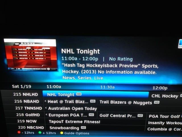 Photo of the Google Fiber onscreen guide. A program is named "hashtaghockeyisgreat".