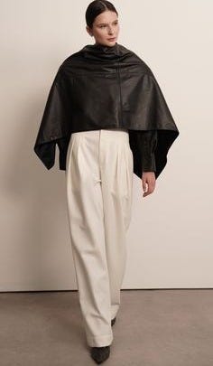 This is the accessory of the year. Crafted from buttery-soft leather, it envelops you in a sleek, minimalist aesthetic. Add a touch of sophistication to your wardrobe with our Leather Cape Scarf. This versatile cape effortlessly elevates any outfit, giving you a truly stylish look. Perfect for any occasion, it's the must-have accessory for the fashion-forward individual. 100% Leather