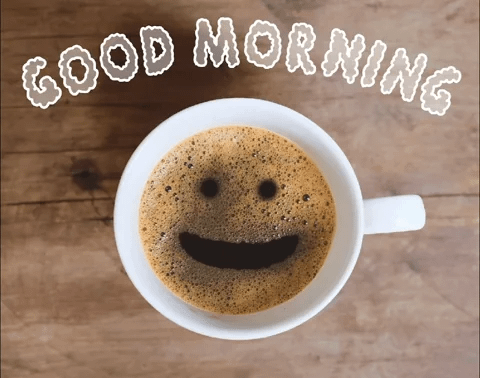 Looking straight down over a cup of coffee, the bubbles form eyes and a mouth that says good morning. Looking straight down over a cup of coffee, the bubbles form eyes and a mouth that says good morning.