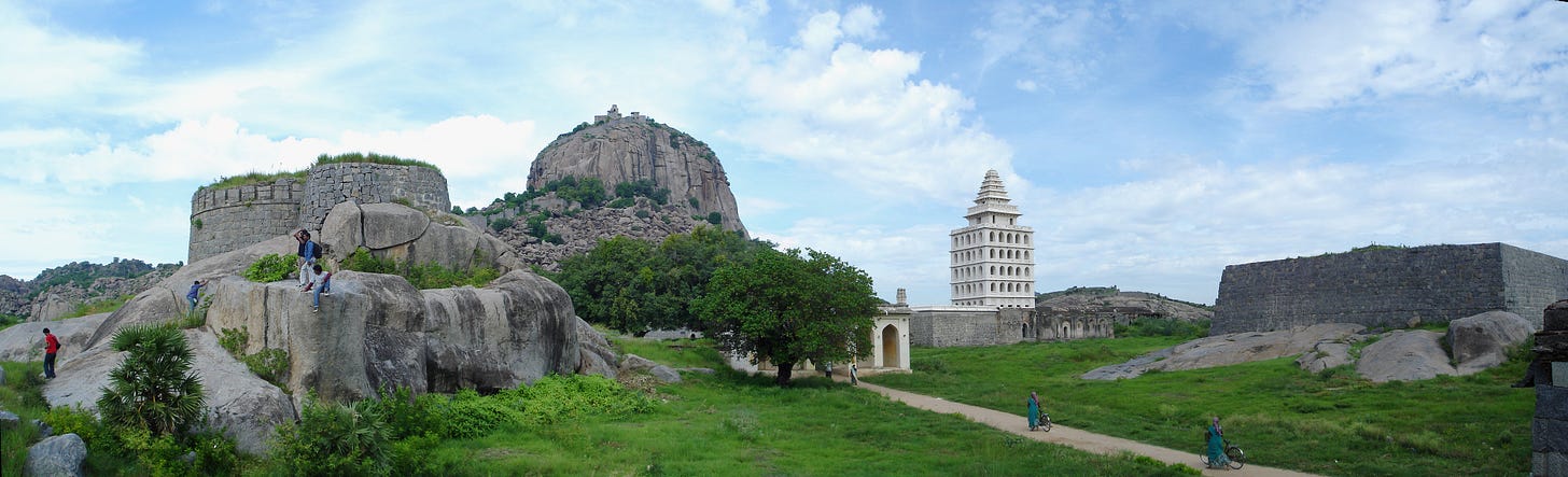A view of the Rajagiri Citadel (atop the hill), Kalyana Mandapam (white tower) and the Mohabatkhan mosque (right) at the en:Gingee Fort complex.