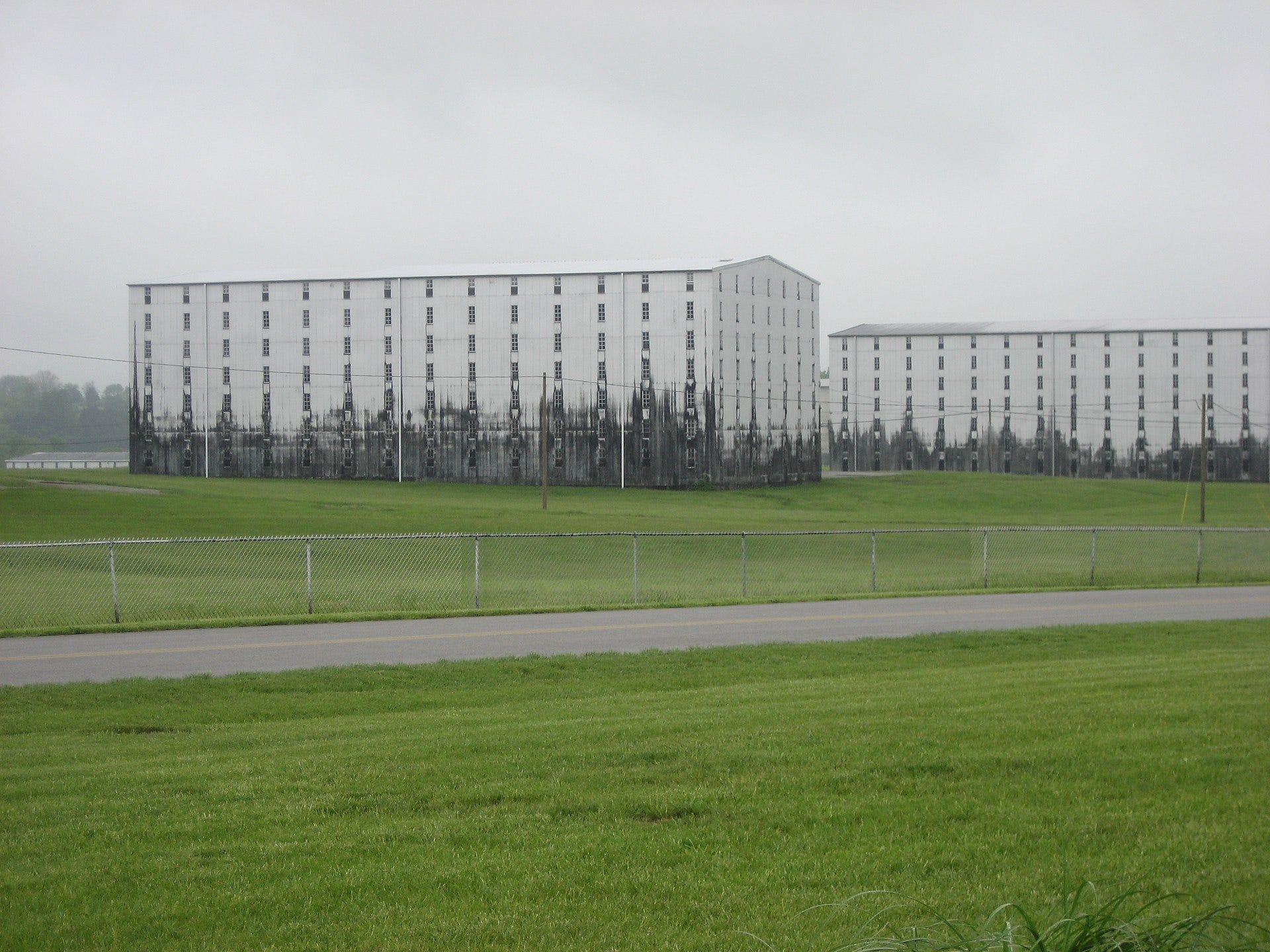 Heaven Hill distillery in Bardstown, Kentucky, US, where fungus is visible on the white warehouses Heaven Hill distillery in Bardstown, Kentucky, US, where fungus is visible on the white warehouses