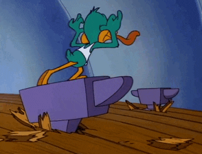 An animated anvil dropping on the head of a cartoon duck An animated anvil dropping on the head of a cartoon duck
