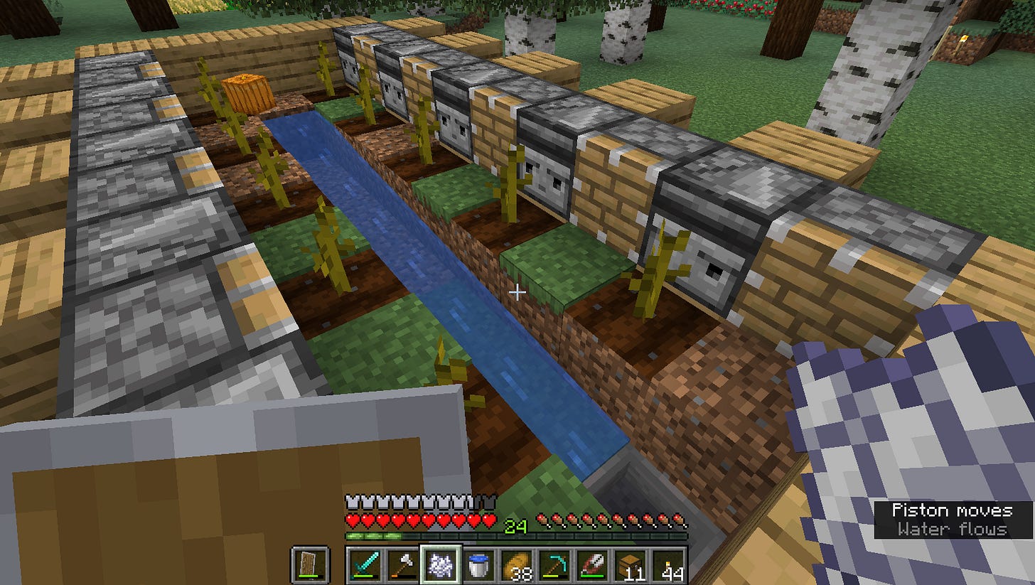 A stream of water with pumpkin plants growing on alternate squares on each bank. "Observer" components watch the plants to see when something changes, and piston components are ready to push the just-grown pumpkins into the water. A hopper collects them at the end of the stream.