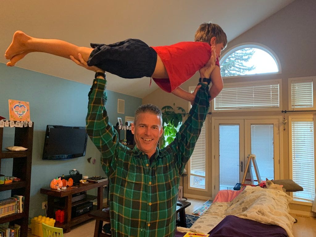 A person holding a child on his shoulders

AI-generated content may be incorrect.