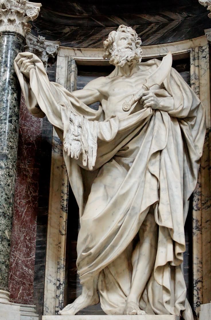This may contain: an image of a statue on the side of a building