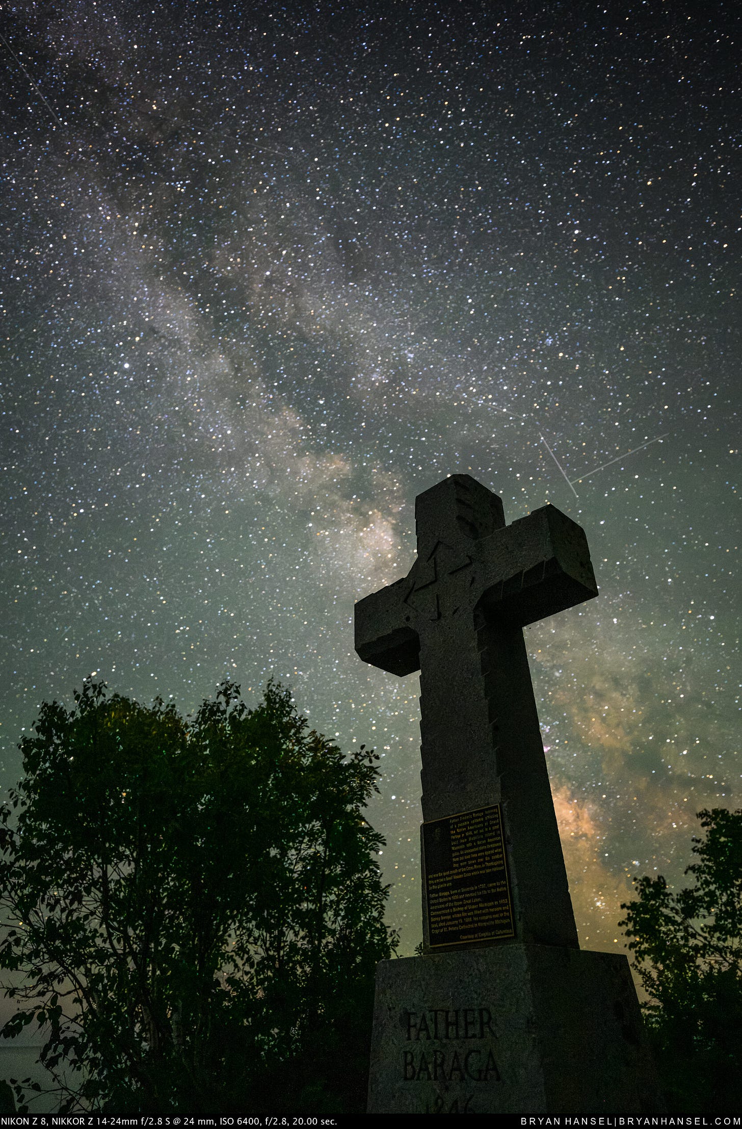 The Milky Way over a stone cross.