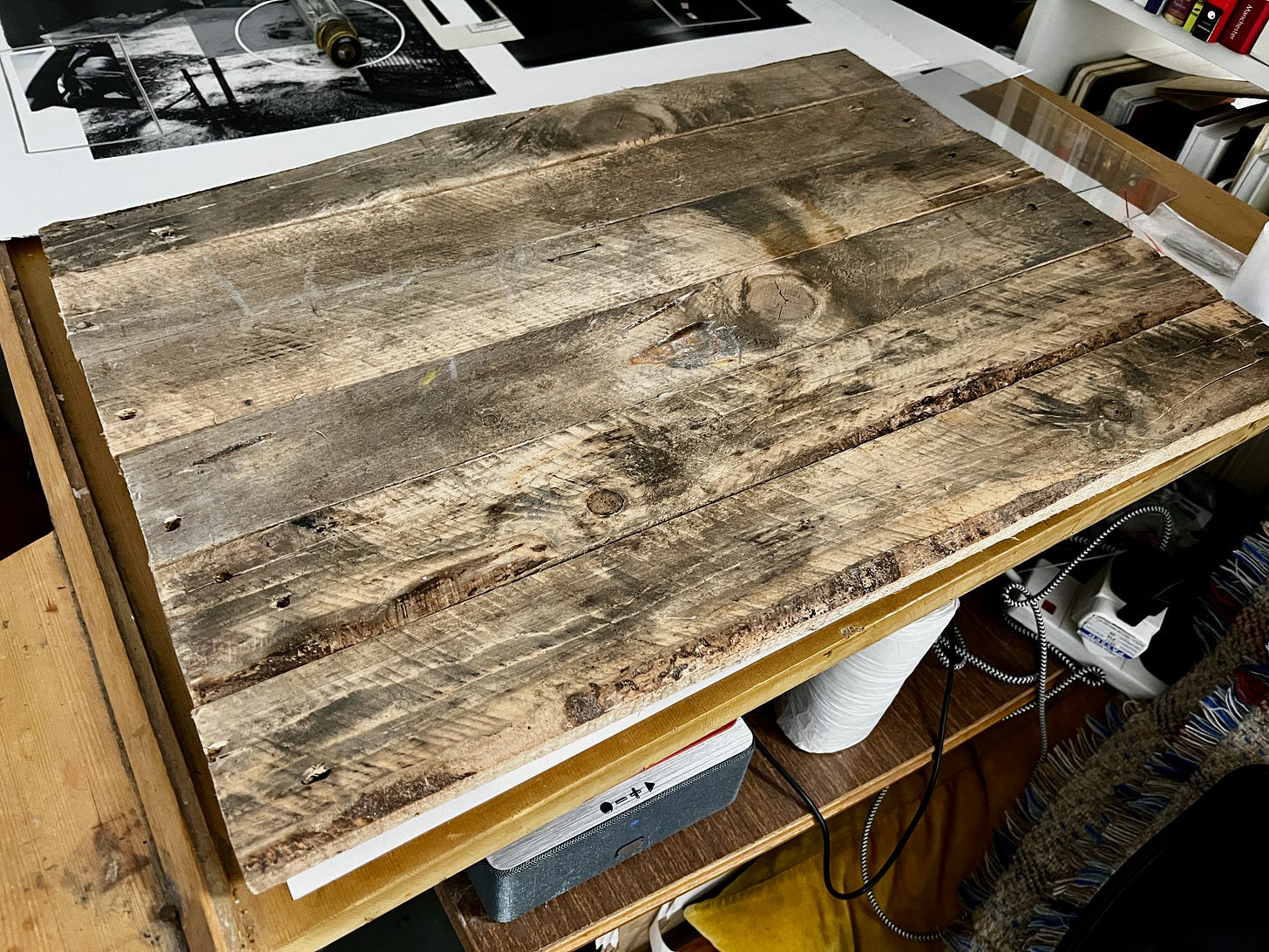 a series of wooden panels assembled to resemble a tabletop