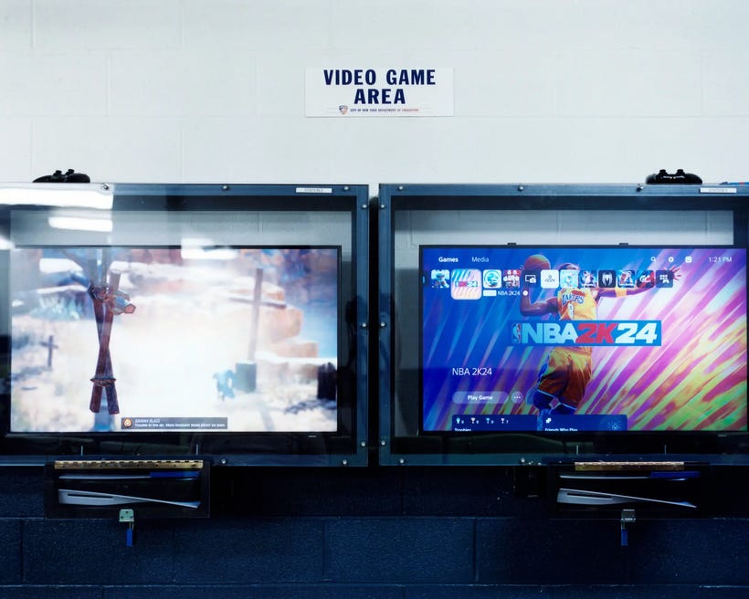 Two TVs playing video games inside Rikers prison Two TVs playing video games inside Rikers prison