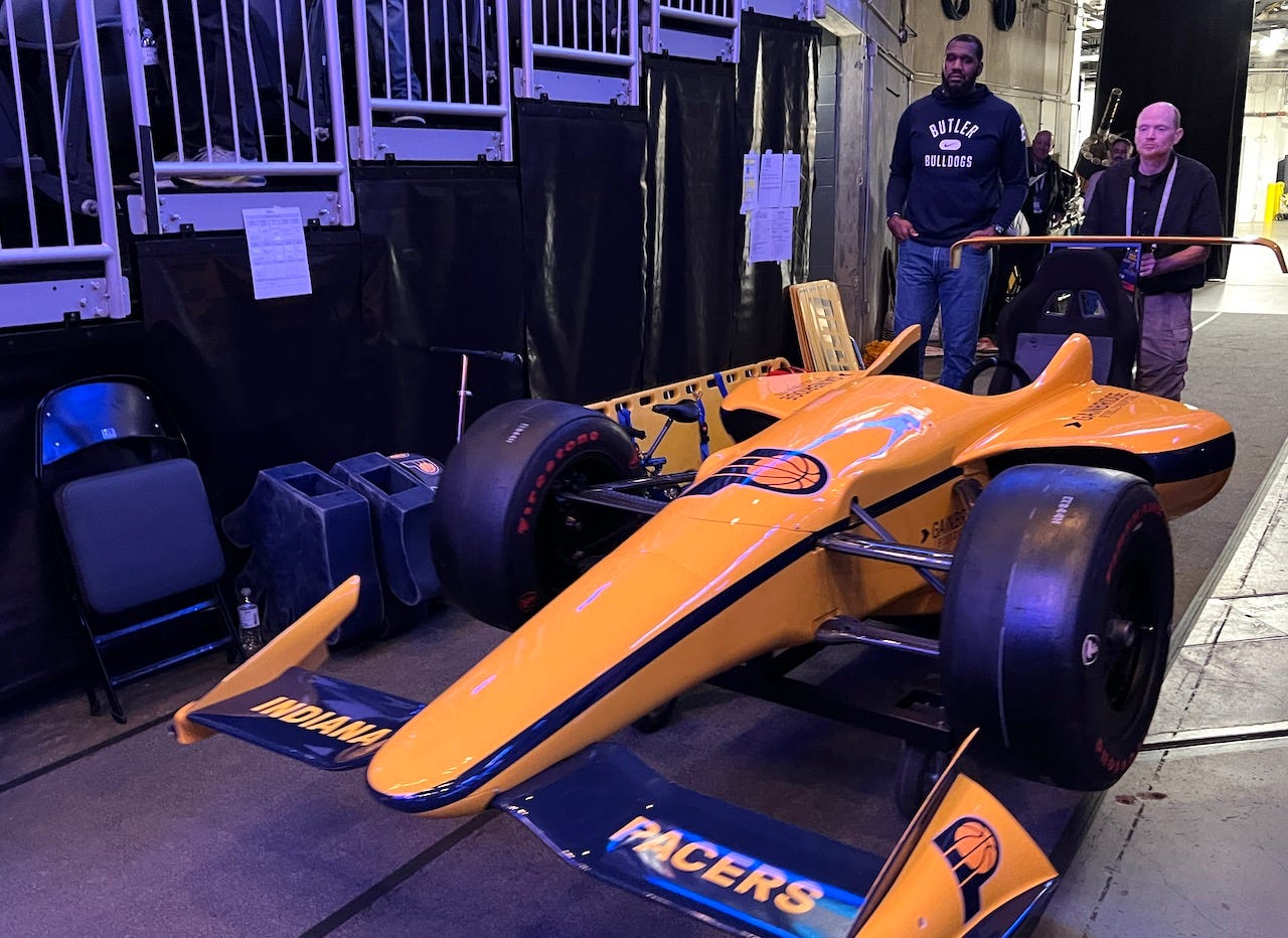 The Pacers’ IndyCar about to be pushed onto the court during team introductions.