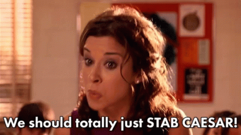 a woman is talking in a classroom and says `` we should totally just stab caesar '' .