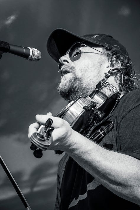 musicians onstage playing country music
