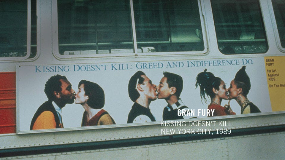 Bus advertisement featuring diverse couples kissing with the message "Kissing Doesn't Kill: Greed and Indifference Do." Promotes AIDS awareness, 1989. Lola and her then-partner are on the far right of the piece. On the left, there is a seemingly straight interracial couple, and in the middle, is a gay man interracial couple. Bus advertisement featuring diverse couples kissing with the message "Kissing Doesn't Kill: Greed and Indifference Do." Promotes AIDS awareness, 1989. Lola and her then-partner are on the far right of the piece. On the left, there is a seemingly straight interracial couple, and in the middle, is a gay man interracial couple.