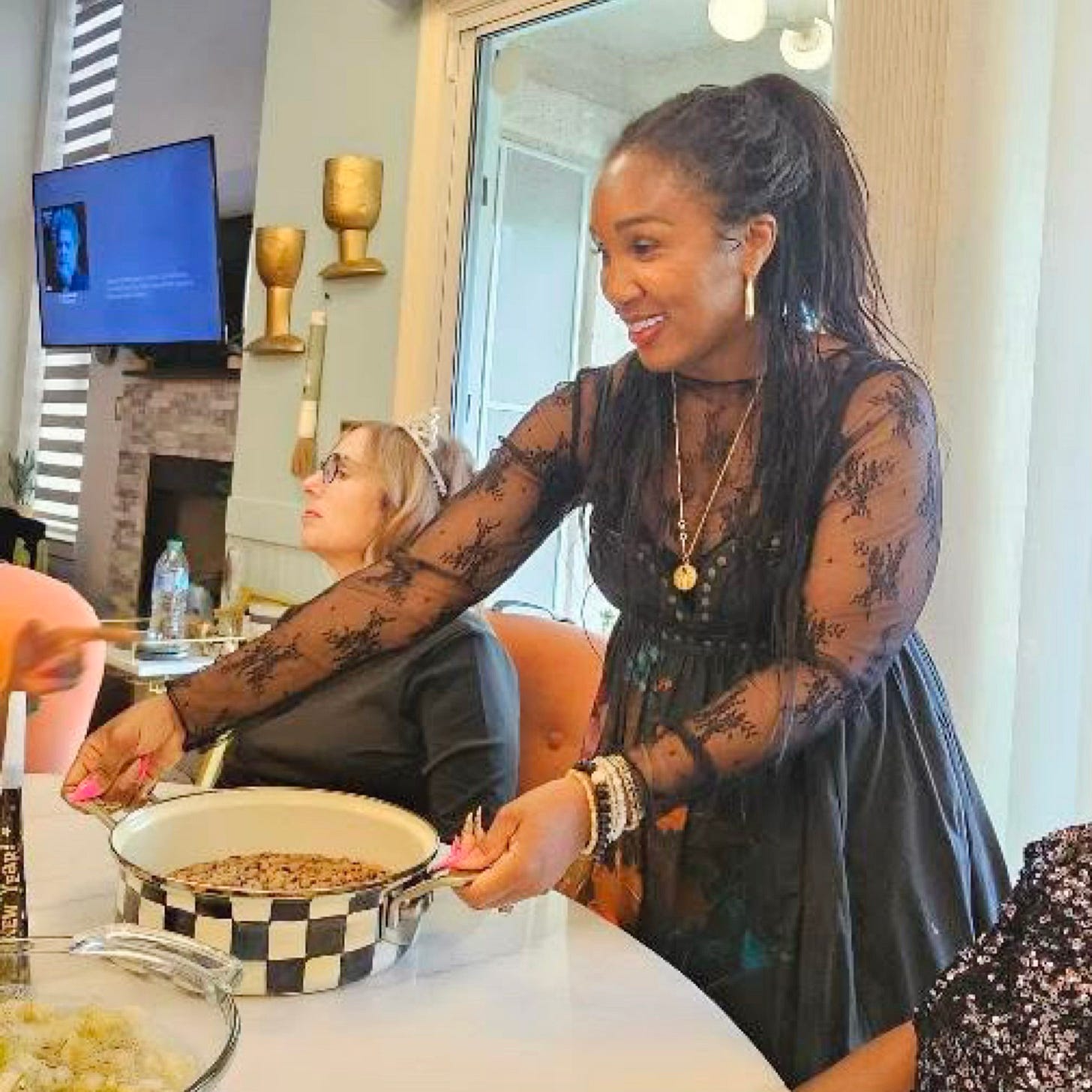 Shaunda Necole serving soul food in her home, reflecting cultural storytelling, hospitality, and the communal experience of Black food traditions