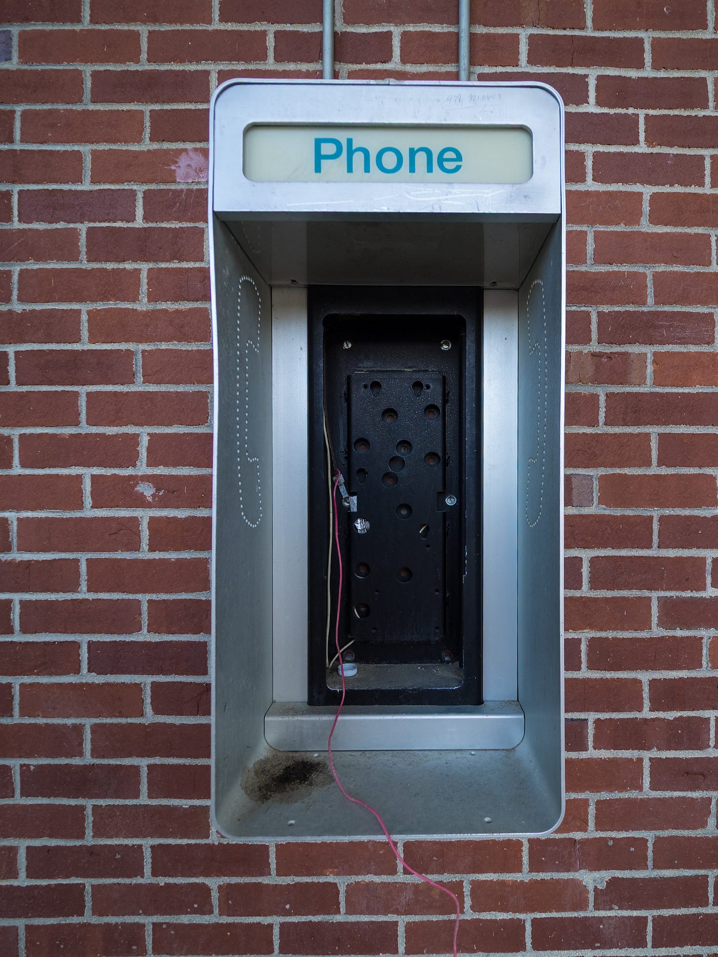 Missing pay phone kiosk