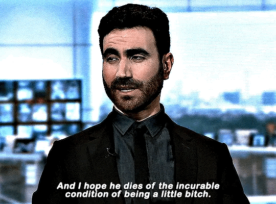 a gif of the character Roy Kent from the TV show Ted Lasso. He is being interviewed in a TV studio, talking about his teammate Jaime Tartt, and says: "And I hope he dies of the incurable condition of being a little bitch." 