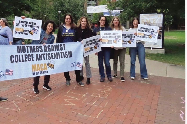 A group of people holding signs

AI-generated content may be incorrect.