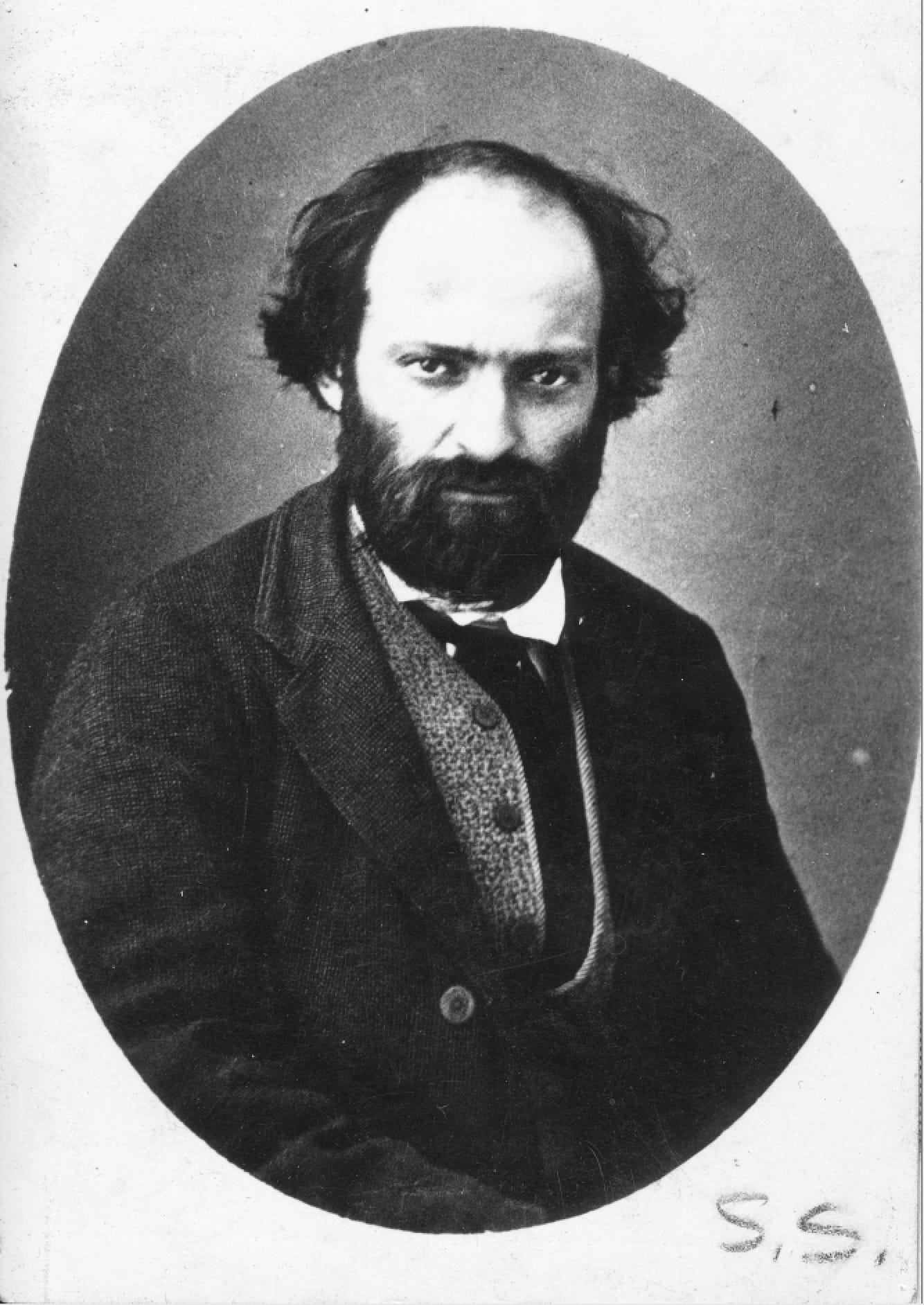 Bearded man photographed outdoors