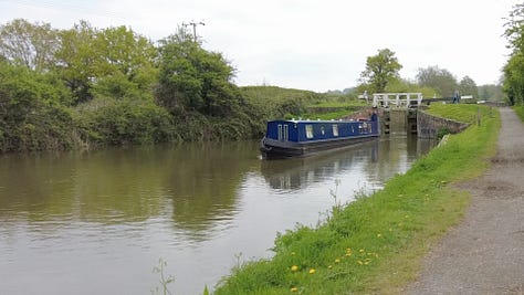 Locks on the Kennet and Avon Canal near Rowde. This is part of the Caen Hill flight of 29 locks. A narrowboat is just leaving heading in the direction of Trowbridge, Bradford on Avon and Bath. Images: Roland Millward
