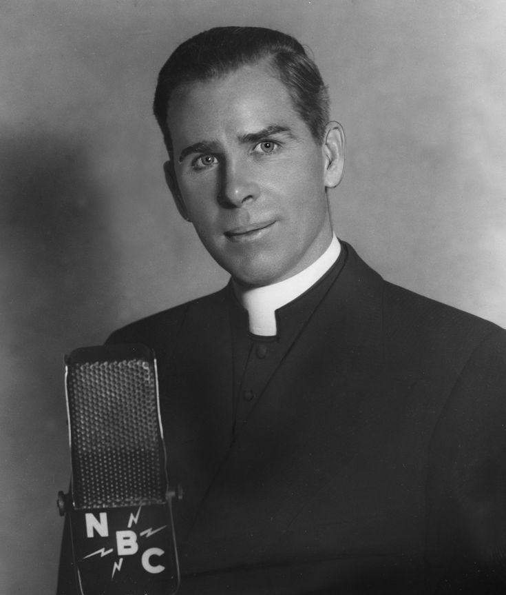 This may contain: a man in a priest's outfit holding a microphone