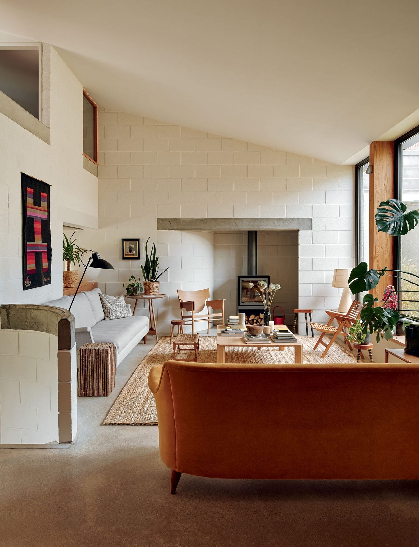 Image may contain Home Decor Architecture Building Furniture Indoors Living Room Room Table Couch and Coffee Table