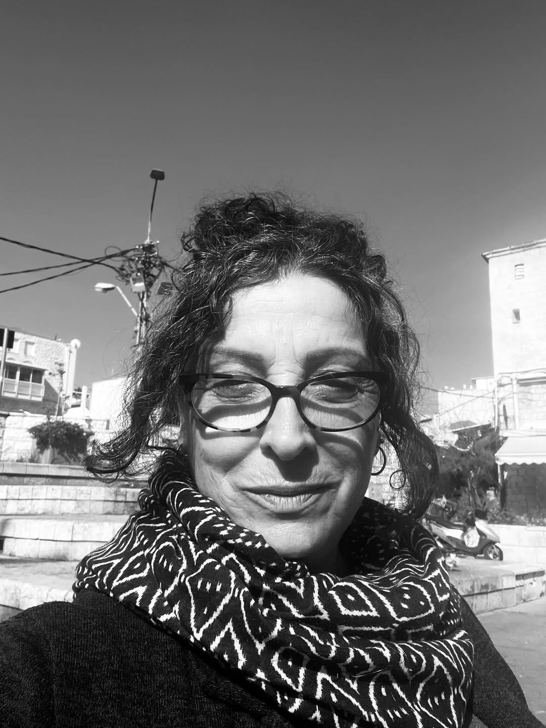 May be a black-and-white image of eyeglasses and scarf May be a black-and-white image of eyeglasses and scarf