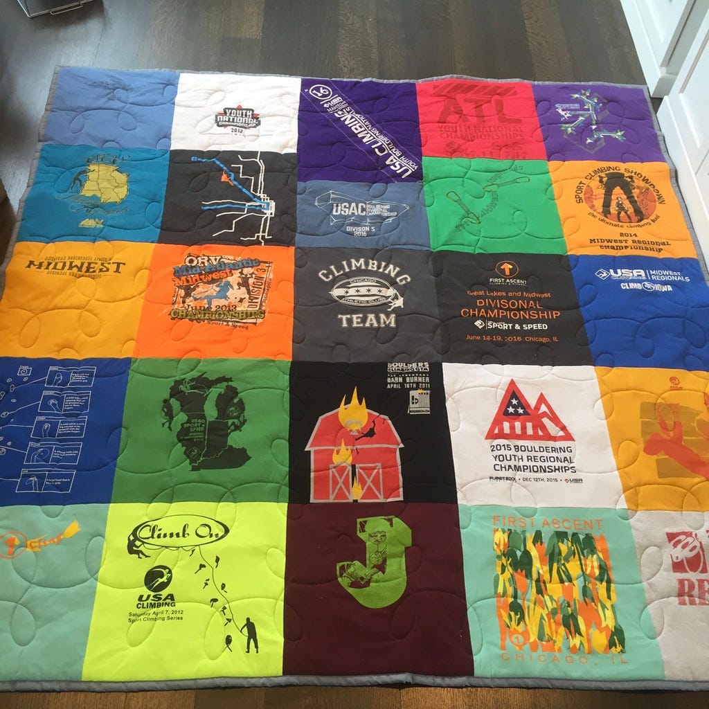A colorful quilt made up of climbing competition t shirts. A colorful quilt made up of climbing competition t shirts.