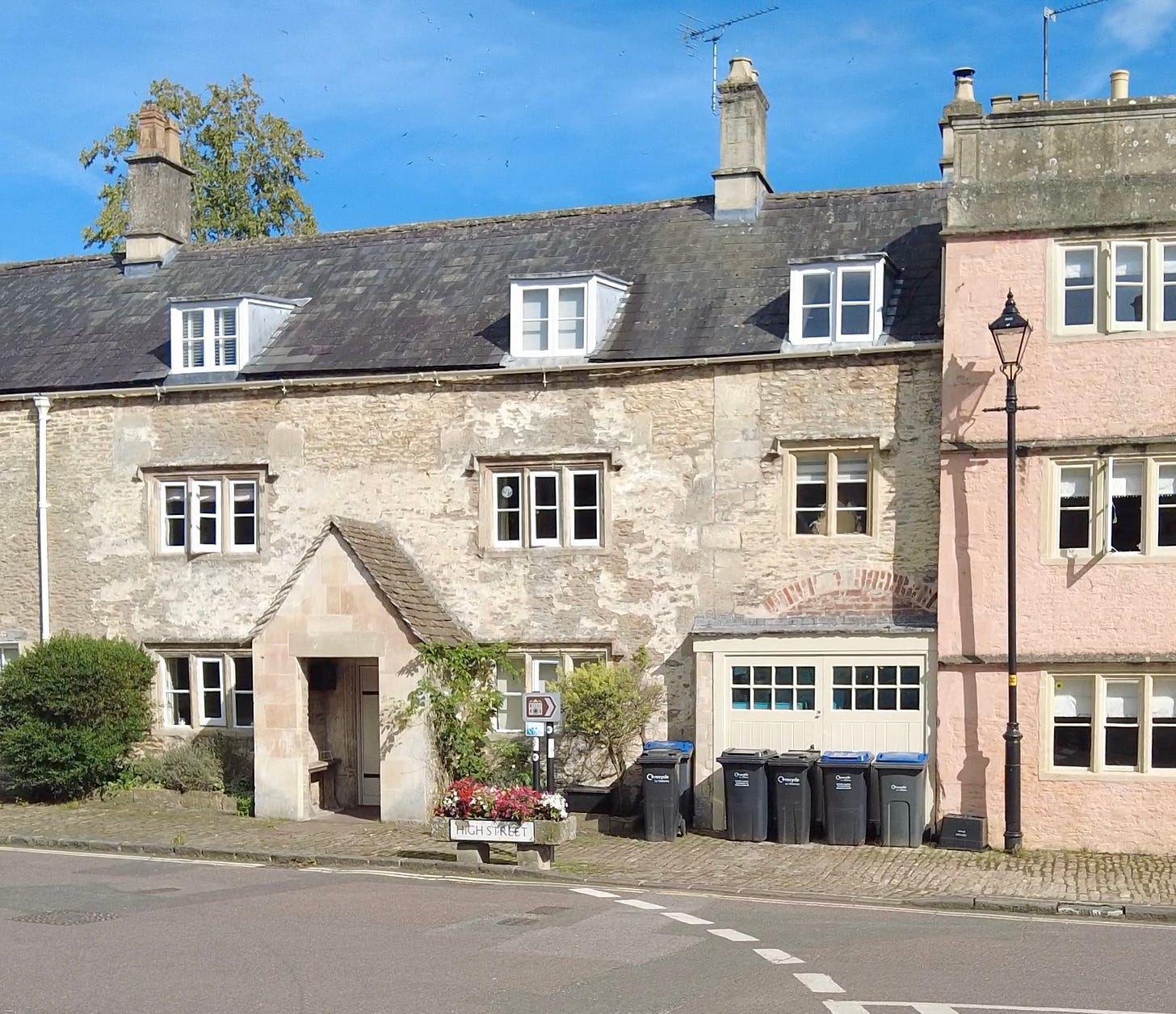 90a High Street, Corsham. This was circa 1800 the first fire station in Corsham. The brick arch above the garage doors might well have been the place the fire engine was stored. Image: Roland's Travels