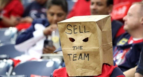 Fed-up Texans fan wears 'Sell the team' paper bag at game