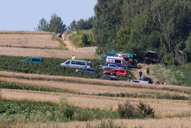 Emergency services work at the site where an unidentified flying object, believed to be a Russian cruise missile, fell after violating Polish airspace, in Tarnawa Kolonia, near Lublin, Poland, July 30, 2026.