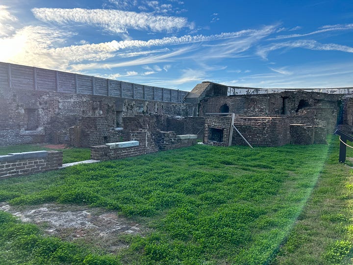 exhibits, sky, clouds, cannon, wheelbarrow