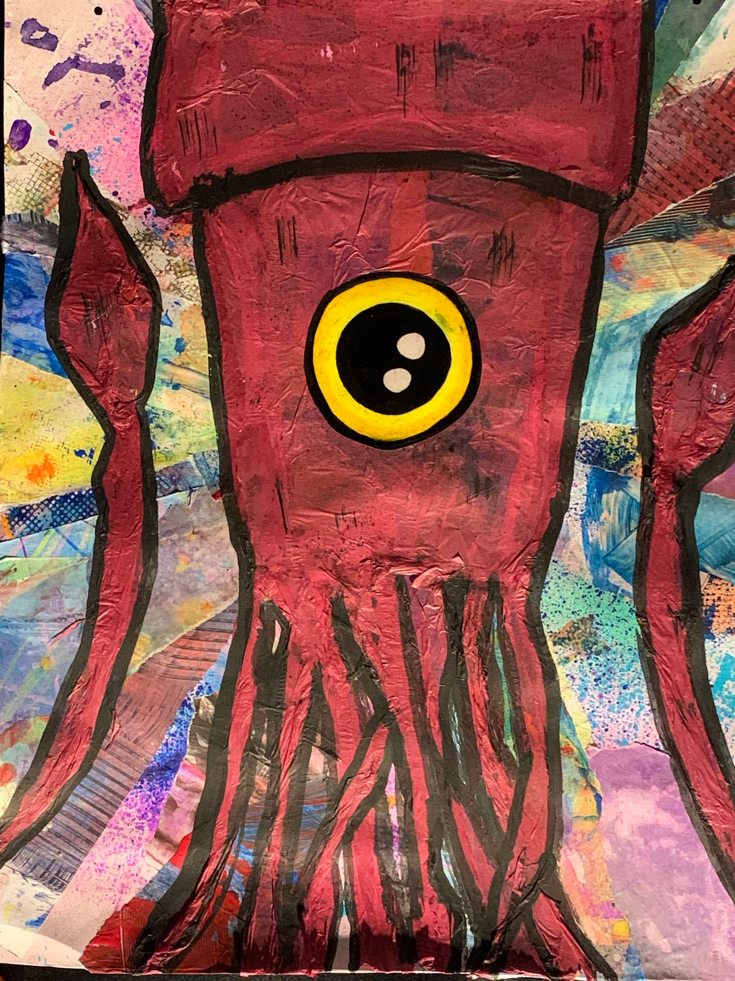 Colorful graffiti of a squid rendered in brick red, with its two long tentacles upraised like hands. A single, giant yellow eye stares out of the center of the squid’s body.
