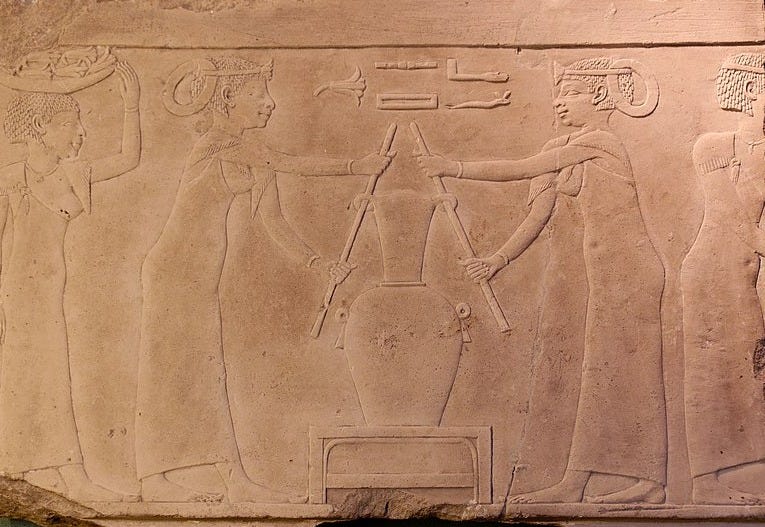 Ancient Egyptian carving depicting perfume making.