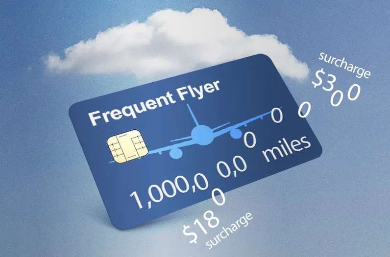 Frequent flyer card displaying miles and fees against a blue sky background