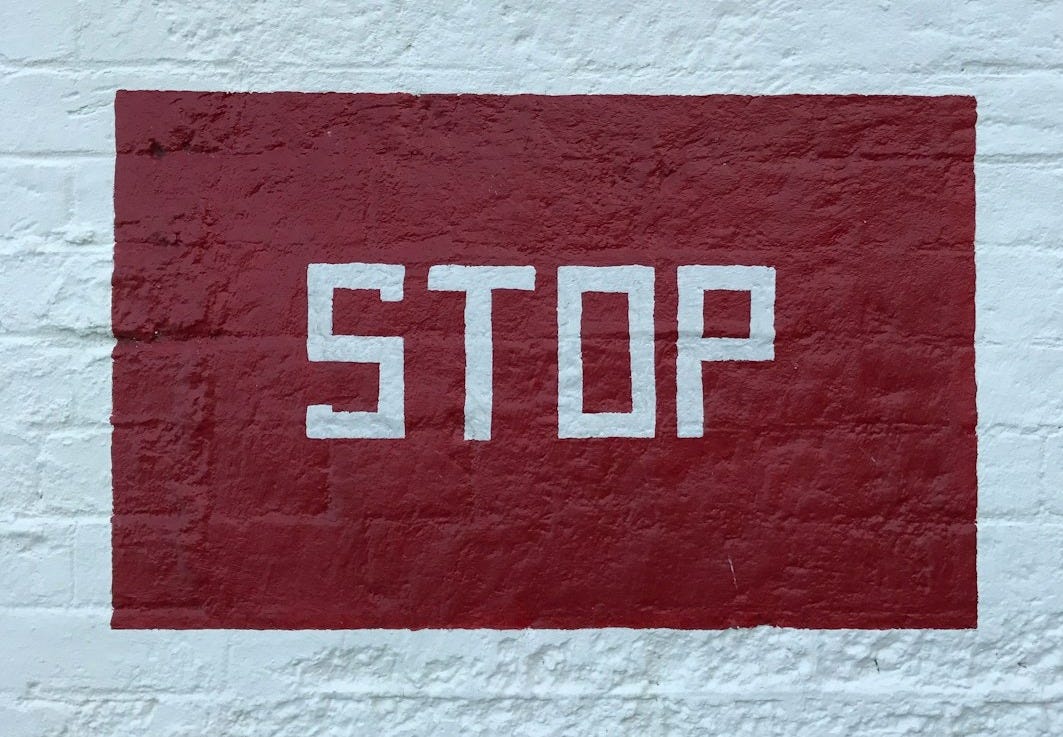 red and white no smoking sign