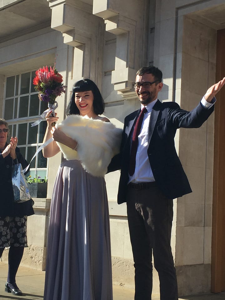 A wedding couple and three sisters