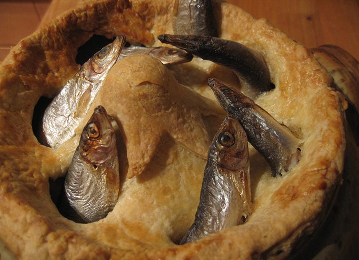 A delectable golden-crusted pie with a half-dozen or so beautiful sardine heads pokin’ outta the crust. Yum yum yum!!! A delectable golden-crusted pie with a half-dozen or so beautiful sardine heads pokin’ outta the crust. Yum yum yum!!!