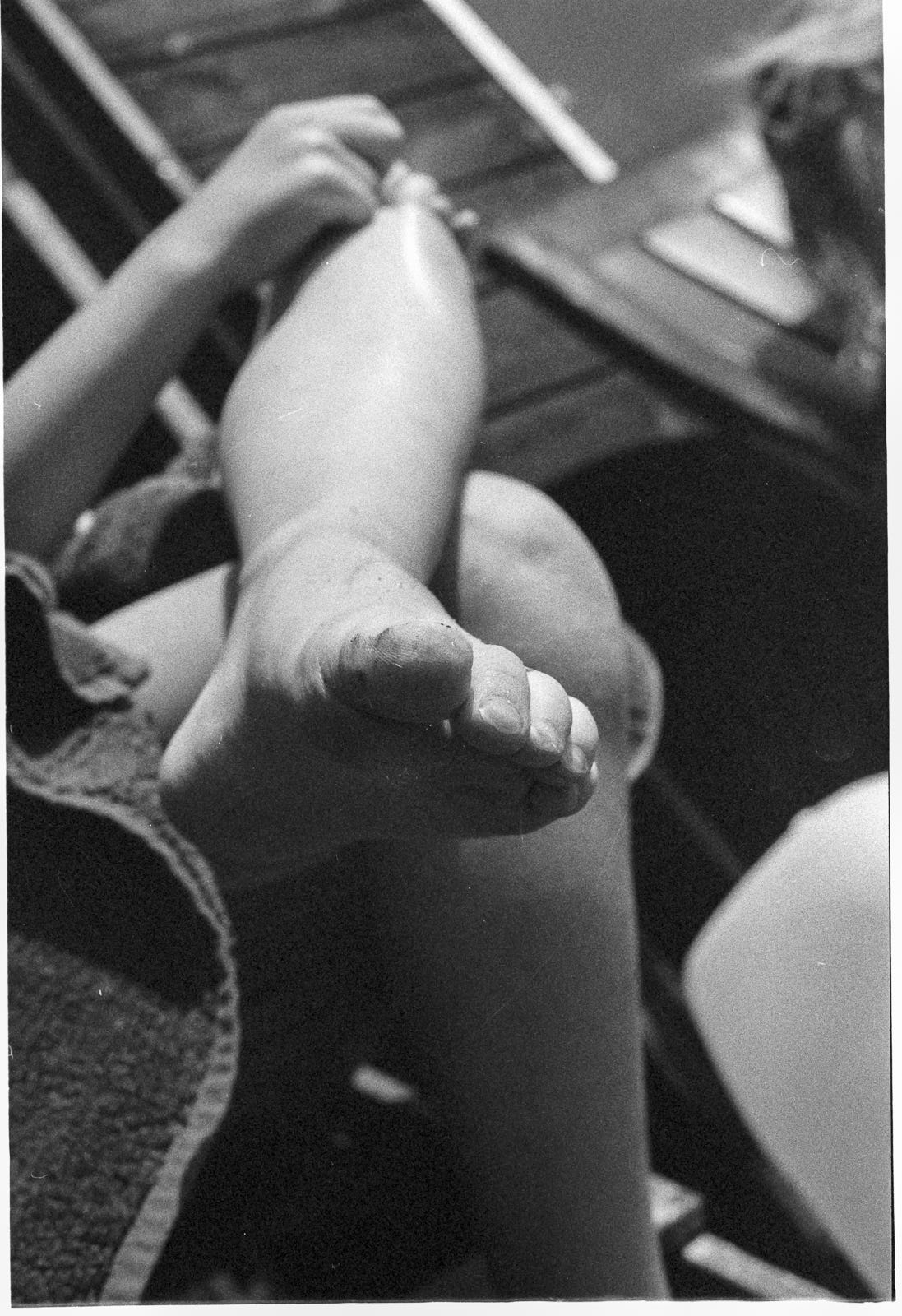 In-focus toe of a child who is reaching for her knee. In-focus toe of a child who is reaching for her knee.