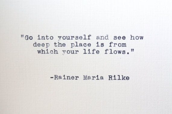 This may contain: an old typewriter with the words go into yourself and see how deep the place is from which your life flows