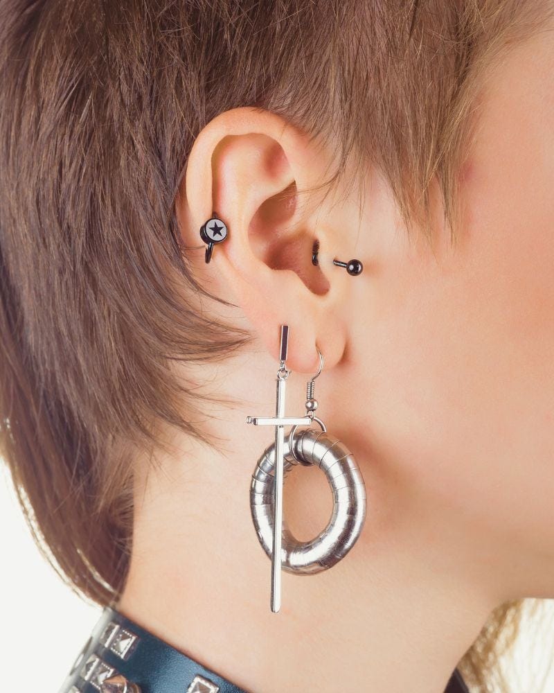 a person with multiple ear piercings to demonstrate the options available for ear piercing over 50 a person with multiple ear piercings to demonstrate the options available for ear piercing over 50