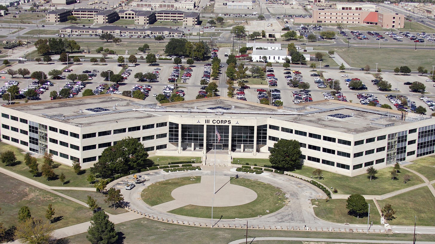 Aerial view of the III Corps headquarters building and its parking lots at Fort Hood, Texas Aerial view of the III Corps headquarters building and its parking lots at Fort Hood, Texas