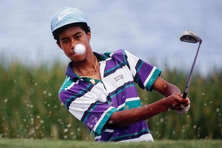 This may contain: a man swinging a golf club at a ball This may contain: a man swinging a golf club at a ball