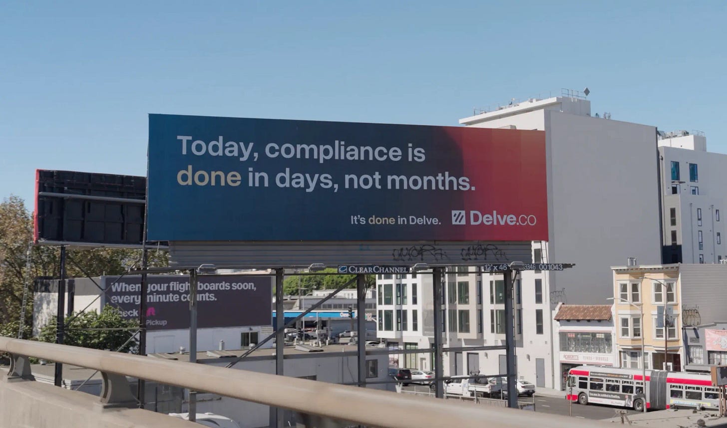 Billboard reading 'Today, compliance is done in days, not months. It's done in Delve. Delve.co' against a clear blue sky and urban backdrop.