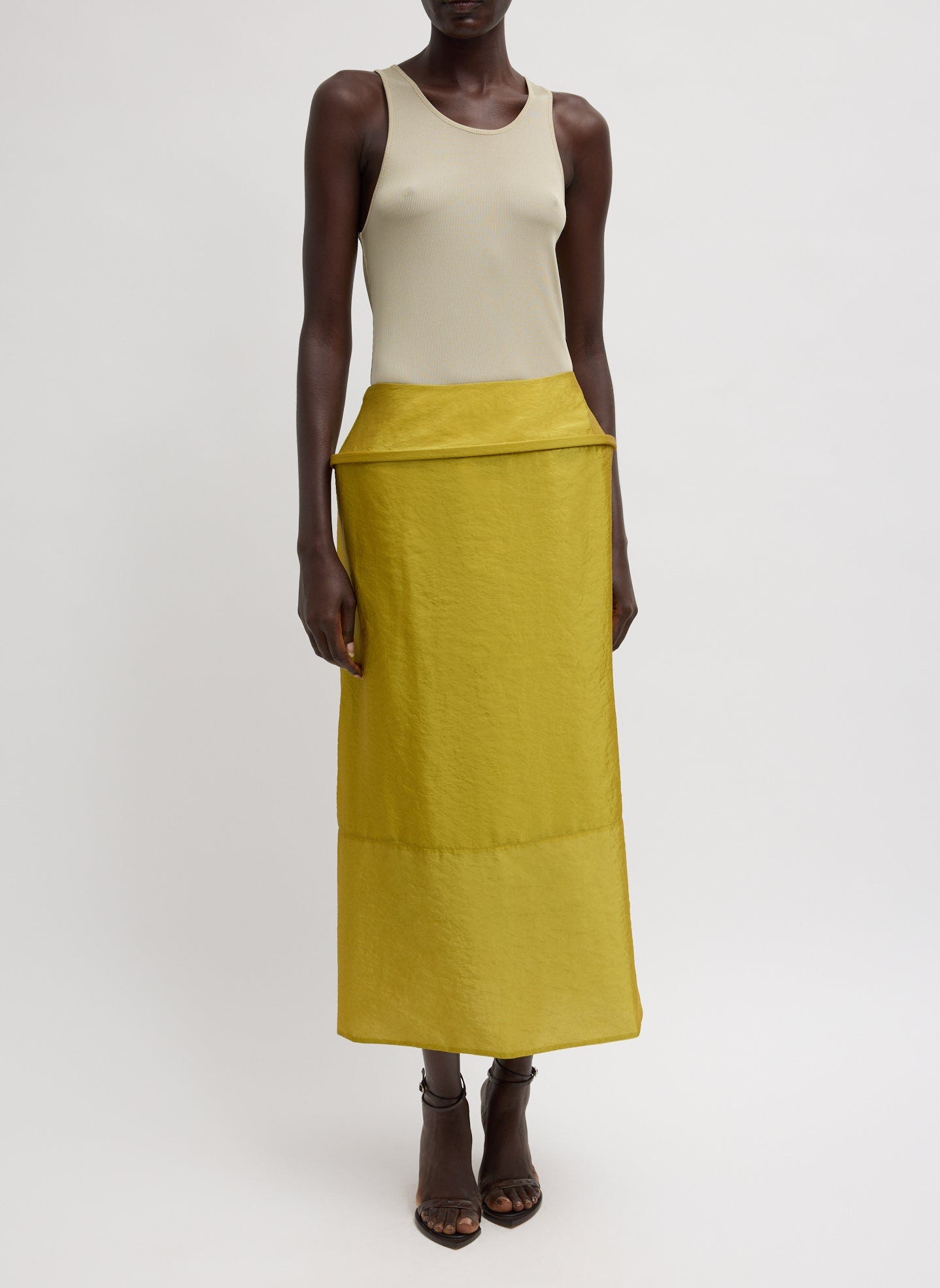 Dijon Chassis Hoop Pencil Skirt - mustard yellow midi skirt with hoop insert at waist, front view on model Dijon Chassis Hoop Pencil Skirt - mustard yellow midi skirt with hoop insert at waist, front view on model