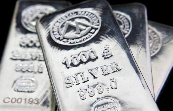 Three silver bars, each weighing 1000 grams, with "SILVER 999.0" engraved on them. Three silver bars, each weighing 1000 grams, with "SILVER 999.0" engraved on them.