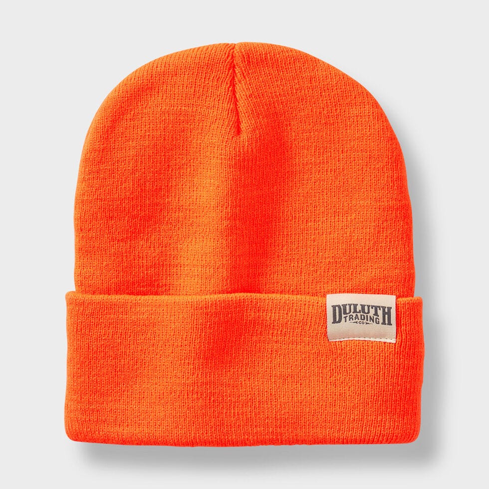 An orange beanie with a logo on it

Description automatically generated