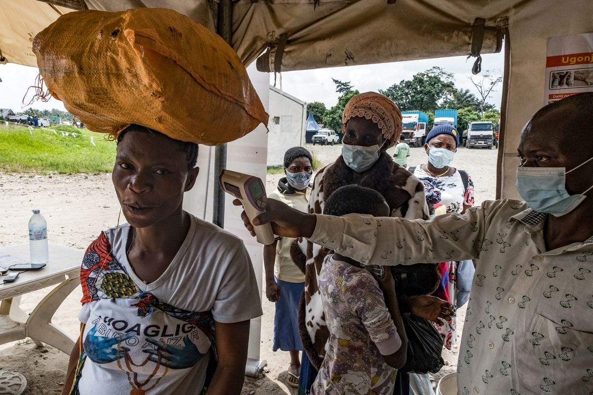 A border health officer at the Busunga crossing between Uganda and the Democratic Republic of Congo A border health officer at the Busunga crossing between Uganda and the Democratic Republic of Congo