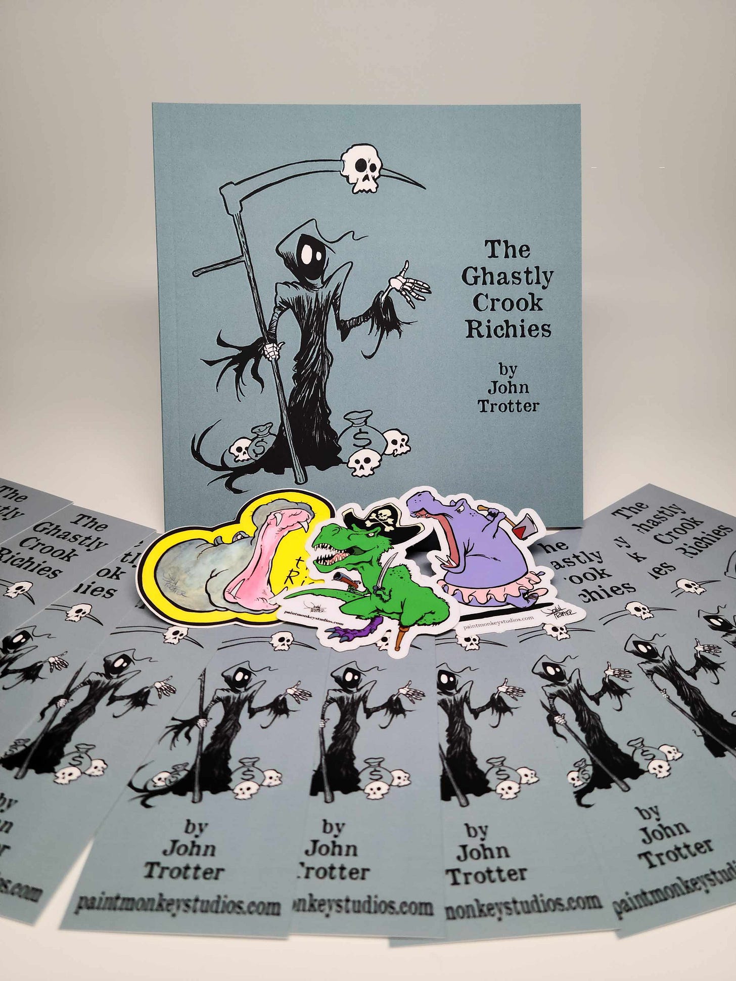 A picture of a book with bookmarks and stickers spread in front. A picture of a book with bookmarks and stickers spread in front.