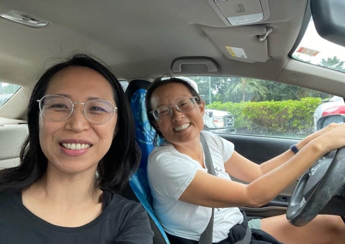 A couple of women in a car

Description automatically generated with low confidence